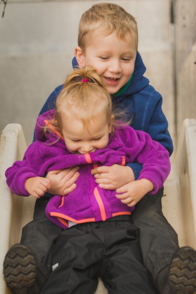 Brother and Sister on the firetruck slide